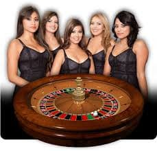 Live Sic Bo dealer with dice dome and betting table layout